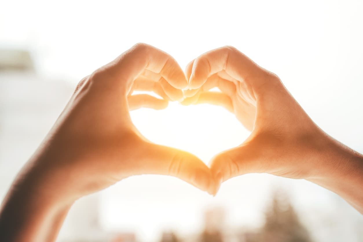 Female hands in the form of heart.